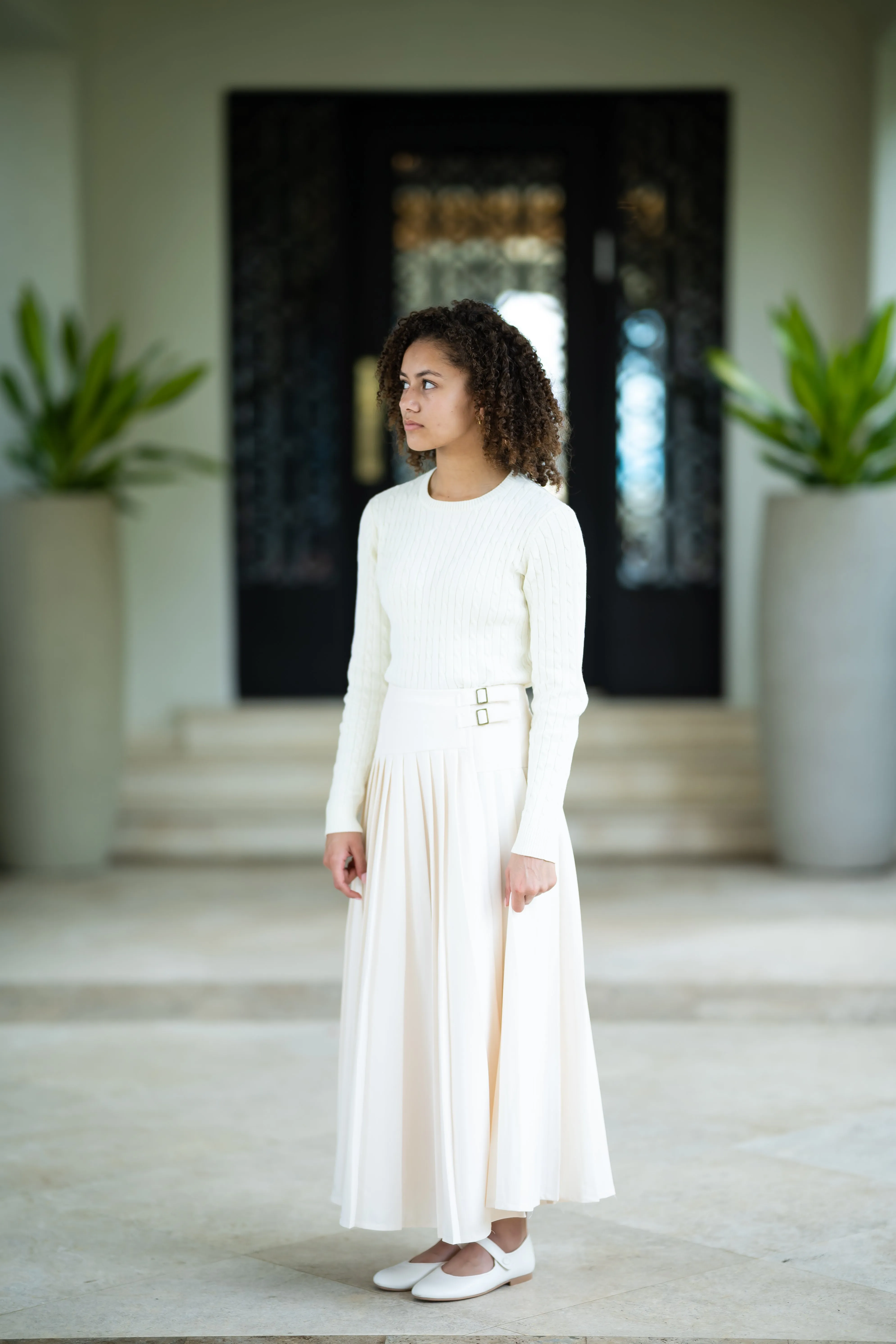 Cream pleated buckle skirt by Coco Blanc